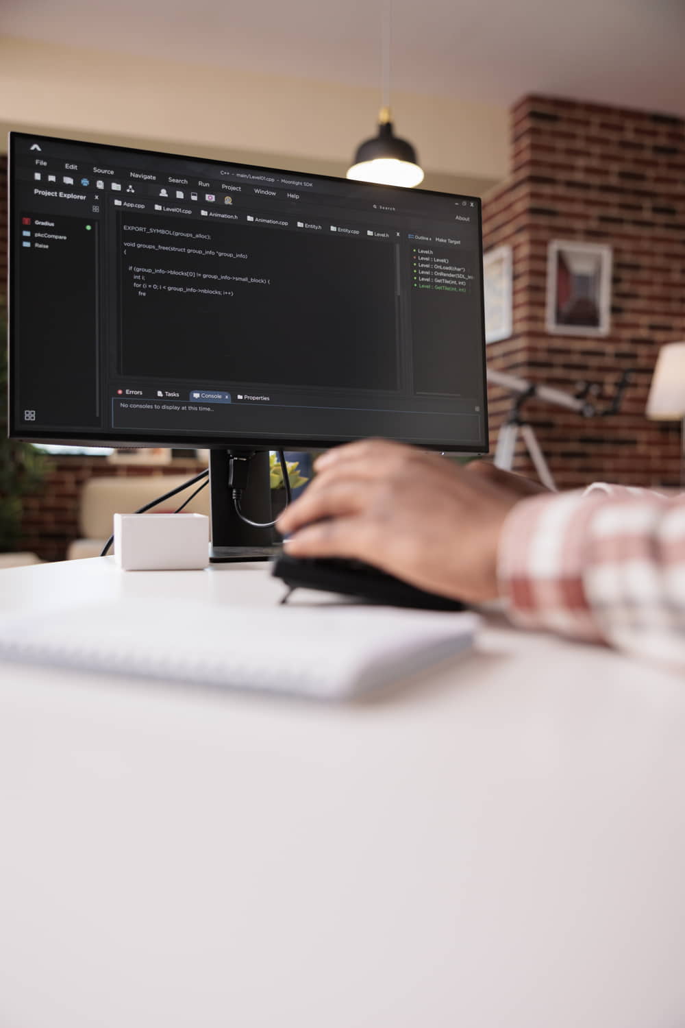 selective-focus-computer-screen-african-american-programmer-working-remote-from-home-developing-software-pc-system-developer-writing-code-personal-computer-typing-algorithm-keyboard